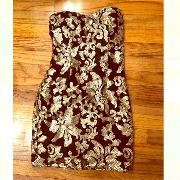 Sexy little black dress with gold accents! - Picture 1 of 2